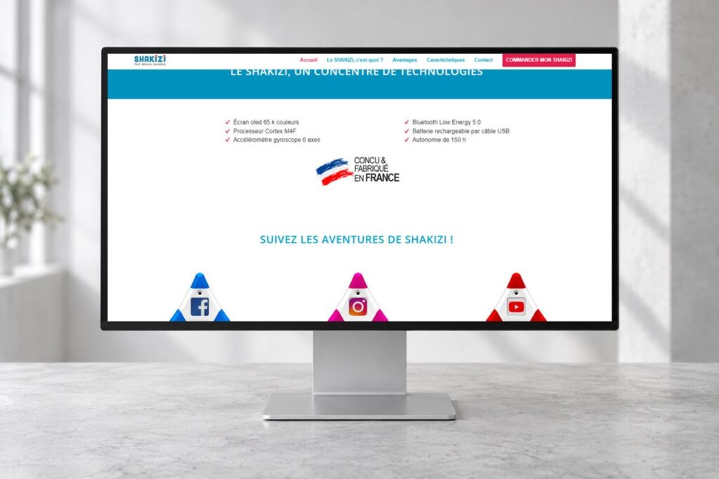 Site Shakizi présenté sur un ordinateur — réalisation web
